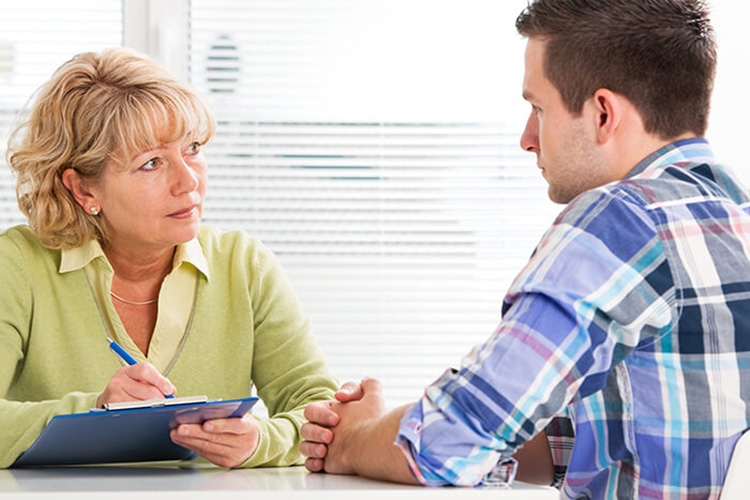 Provider and patient having a discussion.