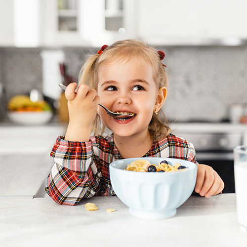 Child eating cereal.