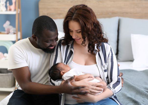 Man and woman holding newborn